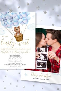 a couple kissing in front of an air balloon with the words baby shower written on it