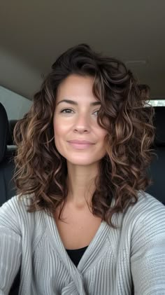 Get fresh and fabulous with our top 12 haircut ideas, specially designed for round faces. Shorter Natural Curly Hair, Curly Brown Hair Colors, Curly Medium Brown Hair, Medium Wavy Haircuts For Round Faces, Round Wavy Haircut, Midlength Haircuts Choppy, Curly Mom Haircut, Medium Haircut Curly, Medium Length Haircut For Thick Curly Hair