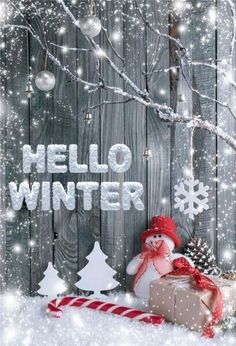 a snowman sitting in front of a christmas tree with presents on it and the words happy new year