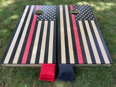 an american flag themed cornhole board on the grass