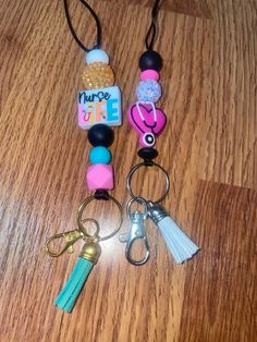 Nurses are health care heros - show your superpower with a this cute lanyard or gift one to a friend. These make cute gifts for graduating RNs as well. Choose your color below based on the tassel for each lanyard. Nurse Bracelet Diy, Pink Beaded Lanyards For Gifts, Cute Multicolor Lanyard As A Gift, Cute Multicolor Lanyards As Gift, Cute Multicolor Lanyard For Gifts, Cute Multicolor Lanyard As Gift, Pink Lanyard With Keychain For Gift, Personalized Multicolor Lanyard For Gifts, Personalized Multicolor Lanyard As Gift