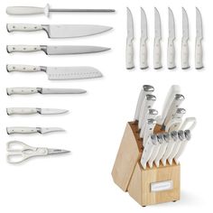 a set of kitchen knives in a wooden holder