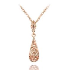 With the finest patterns of scrolling and interlacing tendrils, this vintage feel necklace is truly a work of art. The teardrop is a puffed cage of delicate filigree dangling from a small medallion bail. Hanging 1 1/2 inch from an 18 inch chain, it is both modest and dramatic. Available in Platinum or Rose Gold Plating. Get the matching Arabesque Filigree Puff Teardrop Earrings for the complete look. Size: 1 1/2 inch Chain: 18-inch chain with 2-inch extension Comes Gift Boxed (Reg $79) Twenties Style, Teardrop Necklace, Necklace Vintage, Style Necklace, Rose Gold Necklace, Drop Pendant, Arabesque, Style Jewelry, Teardrop Earrings