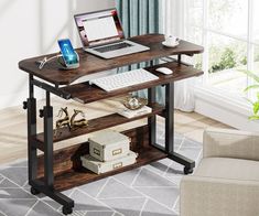 a laptop computer sitting on top of a wooden desk next to a chair in a living room