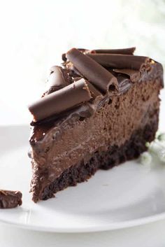 a piece of chocolate cake on a white plate