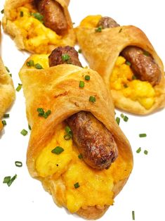 sausage and egg breakfast rolls with chives on the side are ready to be eaten