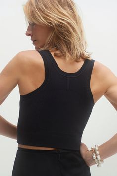 A versatile essential, perfect on its own or layered under your favorite cashmere for easy, stylish comfort. The Brynley cropped tank is a closet must-have. 53% Viscose 45% Nylon 2% Spandex Cropped tank Racerback Rib detailing Corset detailing Jersey knit 13 5/8" length (size small) Dry Clean Only All sale items are FINAL SALE. Casual Crop Top With Built-in Bra And Medium Support, Casual Tank Top With Built-in Bra And Medium Support, Versatile Everyday Crop Top, Everyday Bra Friendly Cropped Tops, Versatile Cropped Tops With Built-in Bra, Chic Stretch Crop Top For Everyday, Versatile Crop Top With Built-in Bra And Medium Support, Everyday Cropped Seamless Crop Top, Seamless Cropped Tank Top