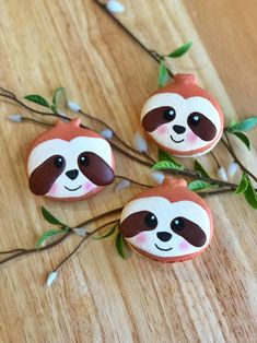 three little slotty buttons sitting on top of a wooden table