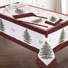 the table cloth has christmas trees on it