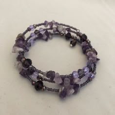 Handmade Coil Bracelet B028 Purple And Black Bracelet, Purple Bracelet Aesthetic, Amethyst Birthstone Jewelry, Purple Bracelet Ideas, Beaded Bracelets Purple, Braided Bead Bracelet, Cottage Core Grunge, Summer Oc, Lavender Bracelet