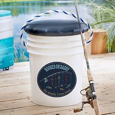 a bucket with a fishing rod attached to it