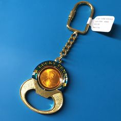 a key chain with a gold coin on it