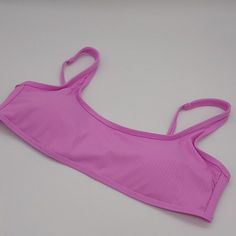 Orchid Bralette Bikini Top In Size Xl By California Waves. - Solid Purple-Pink Color - Ribbed Fabric - Bralette Style - Adjustable Straps - Back Hook Closure - Removable Soft Cups - Lined - Hand Wash - Nylon / Spandex / Polyester - Style #Cw22099vt Brand New Without Tags! Pink Beachwear Top For Pool, Purple Sleeveless Swimwear With Adjustable Straps, Casual Purple Swimwear With Triangle Top, Pink Tops With Built-in Bra For Beach, Purple Seamless Beachwear Swimwear, Purple Seamless Swimwear, Seamless Purple Swimwear For Pool, Solid Beach Tops With Adjustable Straps, Solid Tops For Sunbathing During Beach Season