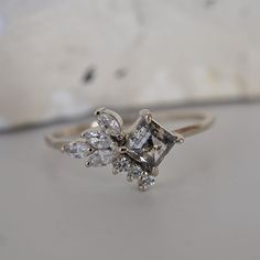 This beautiful Salt & Pepper Diamond Kipling ring features a natural square salt & pepper diamond encrusted with sparkly marquise and round CZ's. Handcrafted in 14K gold. Every salt & pepper diamond is unique and will differ from the photos. 14K solid gold Natural Salt & pepper diamond. Approx. 5x5mm, 0.5ct Round and marquise CZ (what's this?) 1.25mm ring band ** This item is specially made for you. Please allow 1-2 week lead time. Shipping:Domestic: Free standard shipping within the U.S.Interna