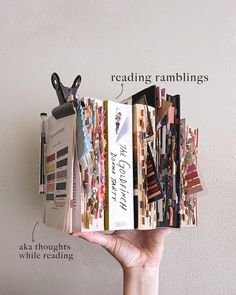 a hand holding up an open book with writing on it and the words reading ramblings