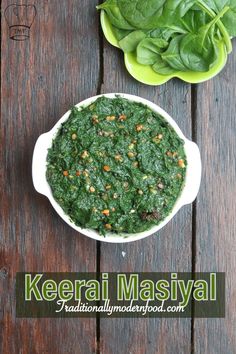 spinach and carrots in a bowl on a wooden table with the words keerai masiyal