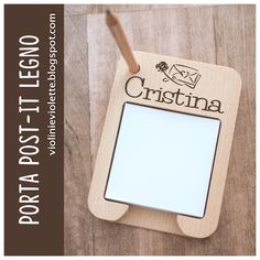 a wooden photo frame with a name tag attached to the front and back of it