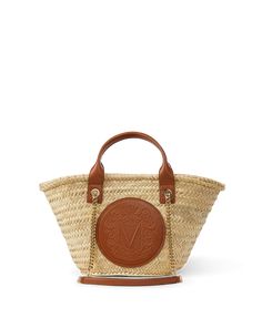 "Find VERONICA BEARD Small Raffia Crest Market Tote Natural Straw on Editorialist. A classic as seen through the VB lens, the small Crest Market tote will always be in style. Made from straw handwoven in Spain, the roomy silhouette is well-sized for a day at the beach or for running errands around town. The leather patch detail is embossed with the brand crest while gold chain shoulder straps and a smooth leather top handle finish the look. Its neutral body keeps styling simple-wear it with anything and everything.17\" L x 6\" W x 10\" H Short strap drop: 4\"; long strap drop: 13\" Straw exterior with leather details Unlined Made from straw handwoven in Spain Store in a cool, dry place and wipe any surface dirt with a dry cloth Style #H2404HRF03Z010" Market Tote, Veronica Beard, Leather Patches, Leather Top, At The Beach, Smooth Leather, Running Errands, Gold Chain, Shoulder Straps