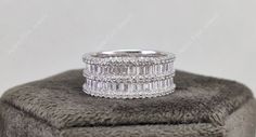 "Baguette Wedding Band, Wide Band Rings For Women, Unique Full Eternity Band Ring, Cubic Zirconia Anniversary Rings, Silver Statement Ring ✻ Product Details ✻ ★ Metal: 925 Sterling Silver ★ Band Width: 9.50 mm ★ Diamond Details: * Stone Shape: Baguette Cut & Round Cut * Stone Type: Lab Created Diamond (Cubic Zirconia) * Stone Color: D/White * Stone Clarity: VVS1 * Total Carat Weight: 5.25 Ct (Change With Ring Size) ★ Want to find out more? Check out my shop:  https://www.etsy.com/shop/AppleFineJewels ★ Custom Orders:  * We accept all kinds of custom changes from customers and we will make this ring for you if you want solid gold or any other stone ring. * If you have pictures or idea what kind of jewelry you want, please share with us we will make according to your idea. * Contact me today Rings For Women Unique, Baguette Wedding Band, Rings Silver, Eternity Band Ring, Statement Ring Silver, Wide Band Rings, Baguette Cut, Engagement Anniversary, Eternity Band