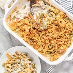 a casserole dish filled with green bean casserole and topped with chicken