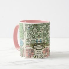 a pink and white coffee mug with a city map printed on the inside of it