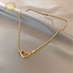 Introducing the epitome of romance and sophistication, behold the 18k Gold-Plated Heart Necklace, featuring a delicate outline of a heart pendant. This exquisite piece combines the luxurious allure of gold plating with the timeless symbolism of the heart, creating a stunning expression of love and devotion. The minimalist design of the pendant allows for effortless styling, making it the perfect complement to both casual and formal attire. Whether worn as a symbol of romantic love or as a meaningful reminder of self-love and empowerment, this necklace is sure to captivate hearts and inspire admiration wherever you go. Gold-tone Gold Plated Heart Necklace, Gold-tone Gold-plated Heart Necklace, Delicate Gold Heart Pendant Necklace, Double Heart Rose Gold-plated Necklace, Delicate Gold Heart Necklace Tarnish Resistant, Delicate Tarnish-resistant Heart Necklace For Valentine's Day, Gold Double Heart Tarnish Resistant Necklace, Delicate Gold Jewelry With Heart Detail, Gold Plated Double Heart Necklace