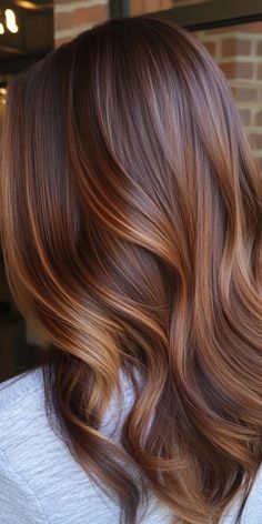 Elevate your hair game with 24 mesmerizing caramel balayage hairstyles that will make you fall in love with your locks. This innovative coloring technique uses hand-painted caramel hues to create a natural, sun-kissed effect that grows out beautifully. From subtle honey highlights to bold caramel streaks, there's a caramel balayage style for everyone. Embrace this versatile technique and enjoy effortlessly chic hair that enhances your features and boosts your confidence. Orange Lowlights In Brown Hair, Dark Blonde Hair Color Ideas Caramel Honey Light Browns, Subtle Balayage Blonde, Subtle Honey Highlights, Brunette Caramel Balayage Hair, Red And Caramel Highlights, Caramel And Blonde Highlights, Caramel Streaks, Blonde And Caramel Highlights