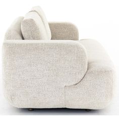 an upholstered couch with two pillows on it