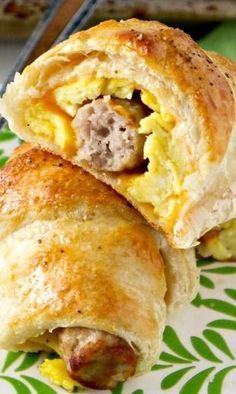 sausage egg and cheese breakfast roll - ups on a plate