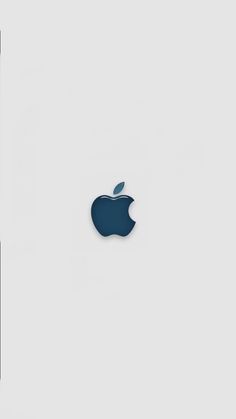 an apple logo is shown on the side of a white wall next to a cell phone