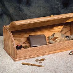 a wooden box with some items in it