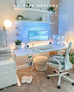 a computer desk with a monitor, keyboard and headphones sitting on top of it