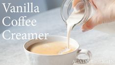 vanilla coffee creamer being poured into a cup