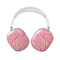 a pair of pink and white headphones with zebra print on the front, against a white background