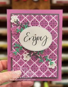 someone holding up a card with the word enjoy on it