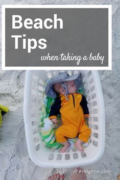 a baby laying in a basket on the beach with text overlay reading beach tips when taking a baby