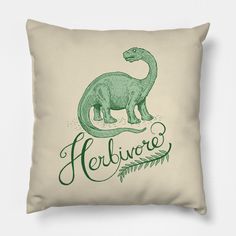 a green dinosaur pillow with the word herbore on it's front and back