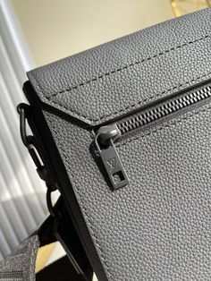 Description L.V Messenger Grain Black For Men, Bags, Shoulder And Crossbody Bags 11in/28cm LV M57080 Rep 1:1 Size: 28 x 24 x 10 cm / 11 x 9.4 x 3.9 inches (Length x Height x Width) The LV Aerogram Messenger’s minimalist design asserts a maximum of style. Sumptuous is combined with subtle signature touches like a customizable tag recalling the stamps on old-fashioned aerograms. Protected by a flap with precision-cut corners, it’s ideal for carrying a phone, tablet or papers, while the zipped rear pocket keeps valuables secure. Black grained Textile lining Black hardware Signature metal initials Customizable signature label tag Main compartment with magnetic flap closure 2 inside flat pockets Zipped rear pocket Strap: Removable, adjustable Include box, dust bag. This product is of the best q Baby Tote Bag, Luxury Products, Louis Vuitton Men, Evening Clutch Bag, Design Minimalista, Vuitton Bag, Black Hardware, Precision Cut, Accessories Store