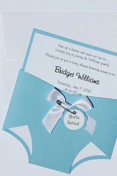 a blue and white wedding card with a bow on the front that reads, bridger williams