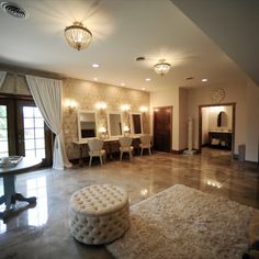 a living room filled with furniture and mirrors