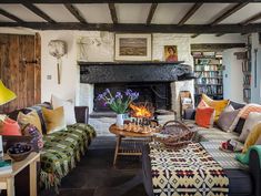 a living room filled with furniture and a fire place