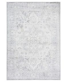 a white rug with an ornate design on the top and bottom, in grey tones