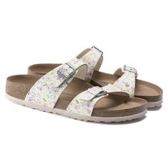 The Birkenstock Sydney Has Both Form And Function. With Its Two Simple Straps, It Covers Fashion And Comfort. Available In Vegan Materials And Includes An Upper Made Of Birko-Flor In A Delicate Watercolor Flower Pattern. Anatomically Shaped Cork-Latex Footbed Upper: Birko-Flor Footbed Lining: Microfiber Sole: Eva Details: Two Straps, Each With An Adjustable Metal Pin Buckle “Made In Germany” White Sandals With Floral Print For Spring, White Floral Print Sandals For Spring, Birkenstock Sydney, Birkenstock Sandals Women, Birkenstock Madrid Big Buckle, White Birkenstocks, Watercolor Flowers Pattern, Birkenstock Style, Orange Sandals