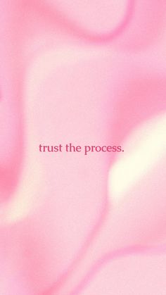 the words trust the process are written in red and white on a light pink background