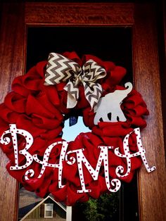 a red wreath with the word bam on it