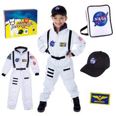 a young boy dressed in an astronaut costume with space suit, cap, and other items