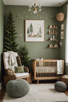 a baby's room decorated in green and white with christmas trees on the wall