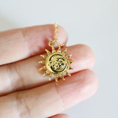 "Beautiful and lovely gold moon and sun face pendant necklace. Made of the gold plated sun and moon face pendant with a skinny gold plated brass chain. Soft and simple. Great for a gift, every day, or on a special occasion.  Your item will ship in a gift box. Please feel free to contact me if you have any questions. ♥ Length  15\" - 20\" chain ♥ Pendant  5/8\" ♥ Gold plated over brass  ♥  See more Rudiana Accessories  Rudiana.etsy.com" Gift Moon And Sun Design Necklaces, Sun And Moon Design Necklace As Gift, Sun And Moon Design Necklace For Gift, Gold Moon Charm Necklace With Sun And Moon Design, Spiritual Gold Charm Necklace With Moon Charm, Gold Charm Necklace With Sun And Moon Design Gift, Gold Dainty Sun Design Charm Necklace, Bohemian Gold Necklaces With Sun And Moon Design, Dainty Gold Charm Necklace With Sun Design