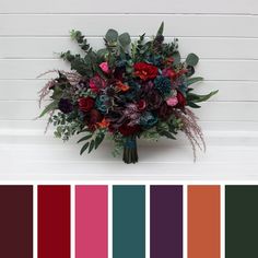 a bouquet of flowers on a bench with color swatches