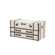 an old fashioned trunk is sitting on the floor, with two drawers and one door open